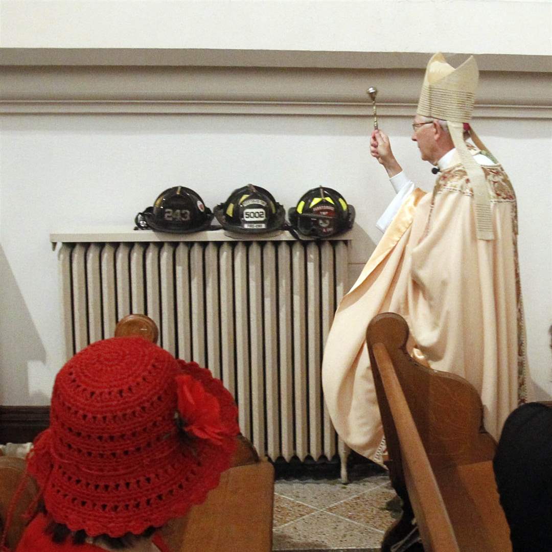 bishop-blesses-helmets