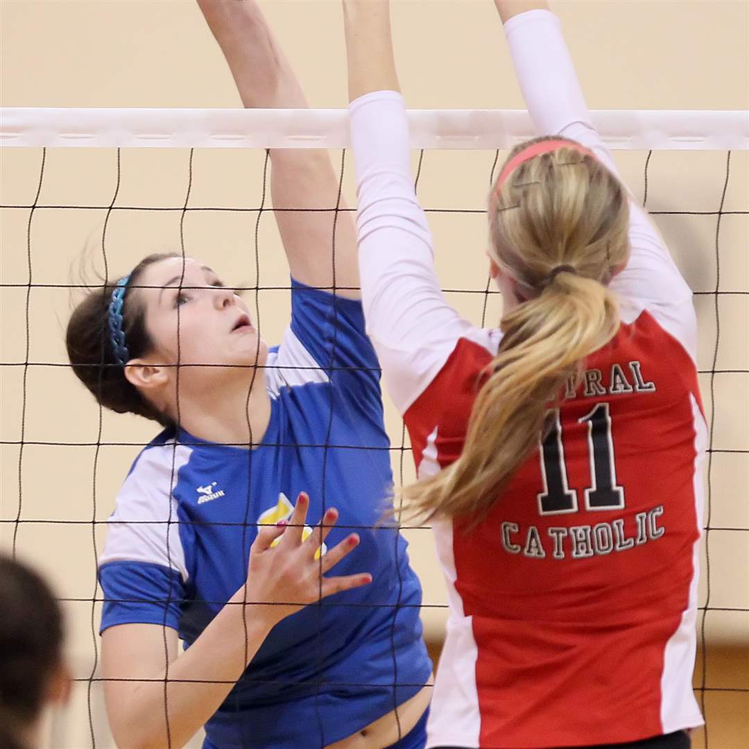 St-Ursula-s-Katie-McKernan-reaches-for-a-spike-with-Central-Catholic-s-Abby-Wietrzkowski-defending