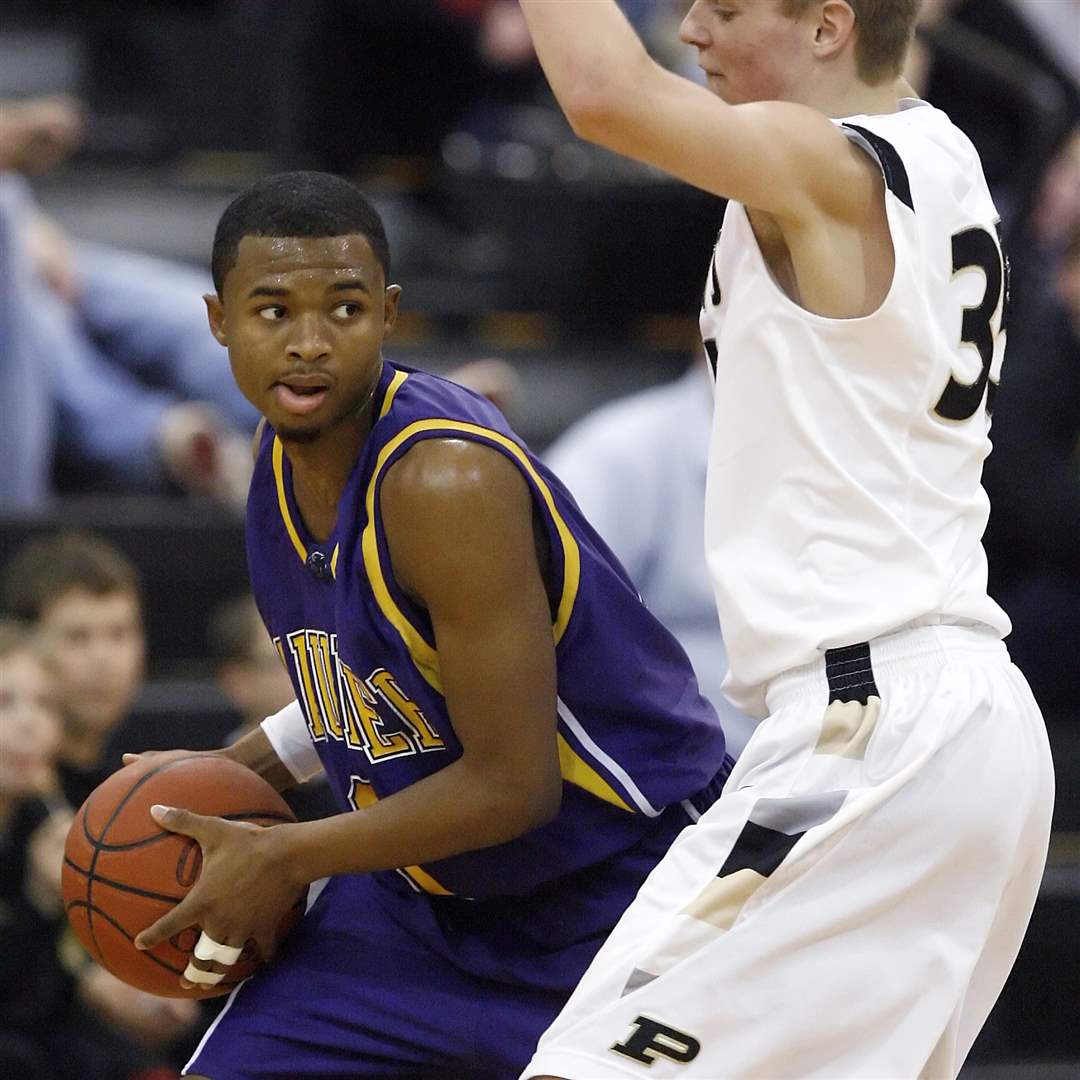 Maumee-s-Dominique-King-tries-to-get-past-Perrysburg-s-Shane-Edwards