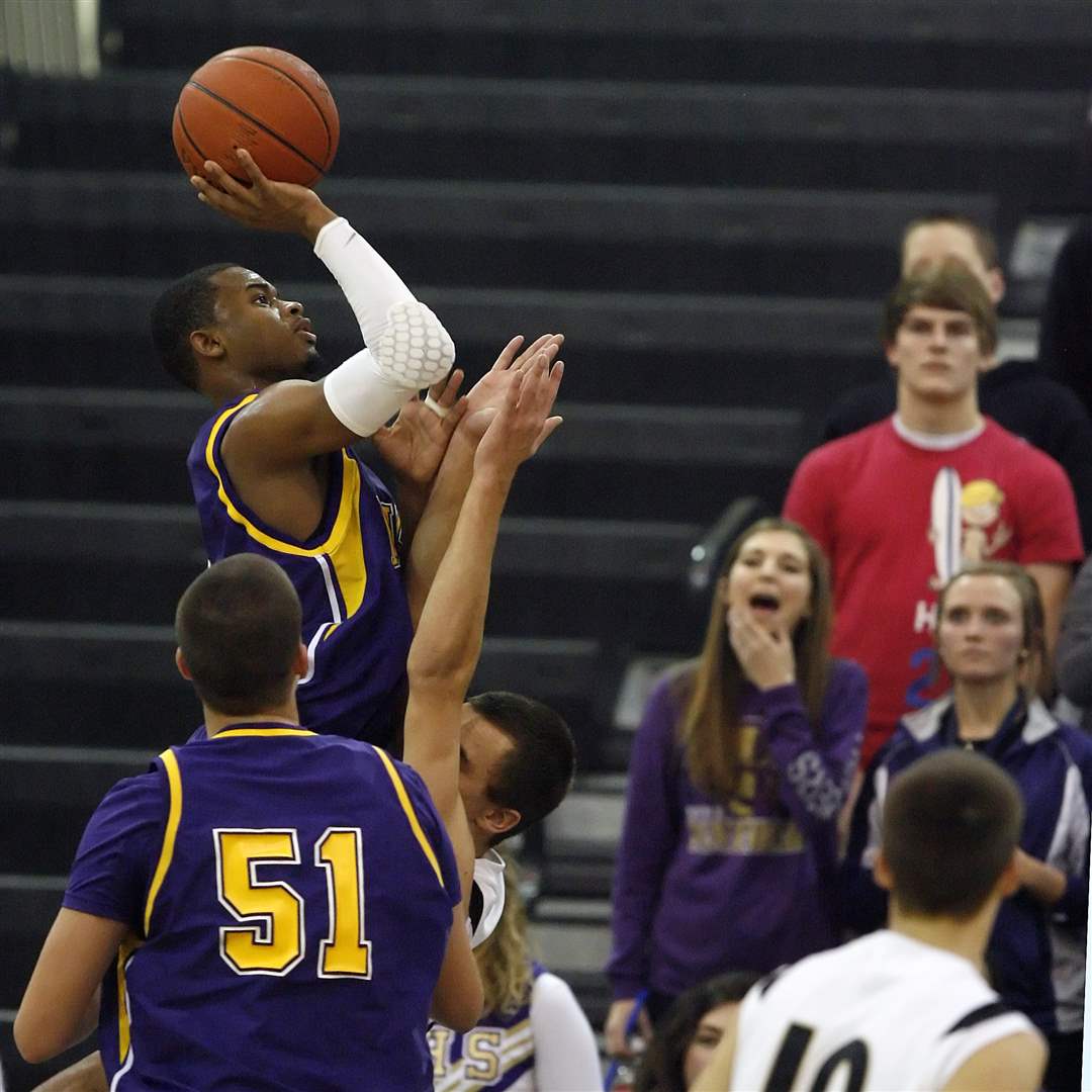Maumee-s-Dominique-King-throws-up-a-shot-against-Perrysburg