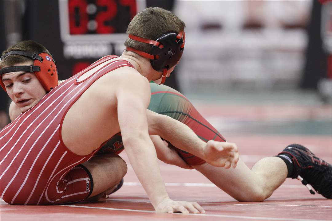 Toledo-Central-Catholic-s-Alex-Mossing-gets-a-takedown-as-he-defeats-Arron-Thompson