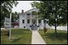 Site-prepared-for-current-President-to-kick-off-bus-tour.jpg The Wolcott House Museum in Maumee was spruced up for President Obama's visit and will welcome him today with red, white, and blue bunting and cascades of purple petunias, accented with American flags.