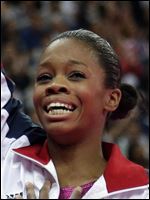 London-Olympics-Artistic-Gymnastics-Women-20.jpg U.S. gymnast Gabrielle Douglas acknowledges the audience after being declared winner of the gold medal during the artistic gymnastics women's individual all-around competition at the 2012 Summer Olympics.