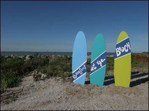 Barefoot-Beach-surfboards.jpg A total of 100 volunteers set up over three days and 40 tore down the next day to put on the Barefoot at the Beach event.