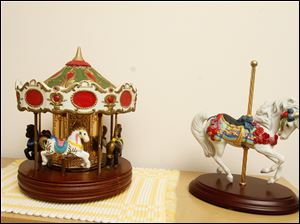 Collect-Call-Horses-Lynn-Burns-carousel.jpg Carousel pieces on a bedroom dresser.