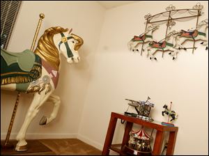 Collect-Call-Horses-Lynn-Burns-bedroom.jpg Lynn Burns' bedroom is fully decorated with carousel horses.