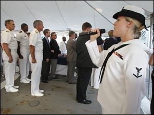 Navy-Week-De-Wert-Michelle-Werner.jpg Musician 3rd Class Michelle Werner sings the Canadian and U.S. national anthems during a reception aboard the U.S. Navy frigate USS De Wert in Toledo.