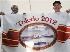 Navy-Week-De-Wert-Mike-Bell-Greg-Nosal-flag.jpg Toledo Mayor Mike Bell, left, presents Rear Admiral Greg Nosal with a flag commemorating Toledo and the bicentennial of the War of 1812.