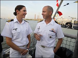 Navy-Week-De-Wert-Ville-de-Quebec-Tanya-Meldrum-Jean-Couillard.jpg Lt. Tanya Meldrum, officer of the watch for the Canadian frigate Ville de Quebec, left, and Lt. Commander Jean Couillard, the ship's executive officer, enjoy a reception aboard the U.S. Navy frigate USS De Wert in Toledo. The Canadian vessel is docked next to the De Wert.