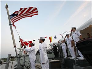 Navy-Week-De-Wert-Ville-de-Quebec-flag-lowering.jpg U.S. Navy Seaman Carl Onyewu, left, lowers the U.S. flag during a reception aboard the U.S. Navy frigate USS De Wert as the crew of the Canadian frigate Ville de Quebec lowers their flag, in background.