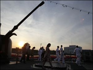 Navy-Week-De-Wert-sunset.jpg The sun sets as party goers tour the U.S. Navy frigate USS De Wert.
