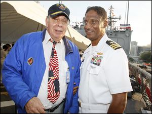 Navy-Week-William-De-Wert-Joseph-Thomas.jpg William De Wert, a former Marine, left, talks with Commander Joseph Thomas, commanding officer of the U.S. Navy frigate USS De Wert, during a reception aboard the U.S. Navy frigate in Toledo. The ship, named for William's brother Richard, was in port for Navy Week and the commemoration of the bicentennial of the War of 1812. Richard De Wert was posthumously awarded the Medal of Honor for his heroism while serving with the 7th Marines during the Korean War.