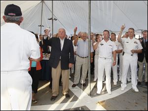 Navy-Week-De-Wert-Nosal-toast.jpg Rear Admiral Greg Nosal, back to camera, left, asks guests to raise their glasses and toast servicemen who could not be there.