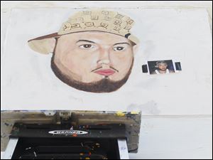 Broadway-murals-Leandra-Leroux-nephew.jpg A portrait of the nephew of OLA artist Leandra Leroux is being painted by Jose Martinez.