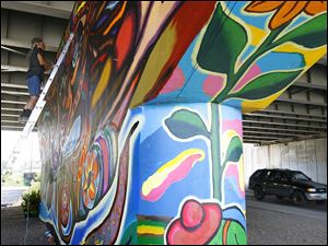 Broadway-murals-concrete.jpg Gray concrete is transformed into a riot of color.