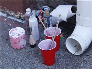 Broadway-murals-supplies.jpg Supplies used to paint one of the murals.