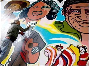 Broadway-murals-Torero-assist.jpg Mario Torero was assisted by students from Bowling Green State University and Libby High School as well as area residents.