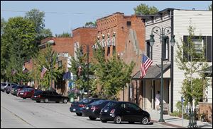 Grand-Rapids-Ohio-downtown.jpg Cars are parked along Front Street in Grand Rapids. The town lost its hardware store, its grocery, and its pharmacy. Then Dorinda Shelley bought a gift-shop business and renovated it.