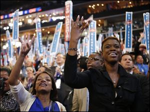 Democratic-Convention-delegates-cheer-first-lady.jpg Delegates cheer as First Lady Michelle Obama addresses the Democratic National Convention.