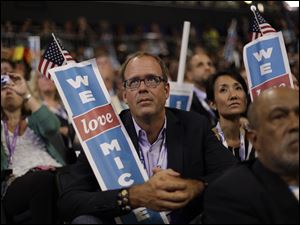Democratic-Convention-we-love-Michelle.jpg A delegate holds a