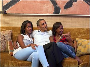 Democratic-Convention-President-Obama-Malia-Sasha.jpg In a handout photo, President Barack Obama and his daughters, Malia, left, and Sasha, watch the 2012 Democratic National Convention on TV from the Treaty Room of the White House in Washington.