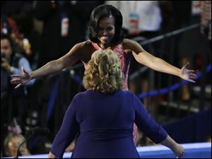 Democratic-Convention-Michelle-Obama-Elaine-Brye.jpg First Lady Michelle Obama hugs Elaine Brye before speaking.