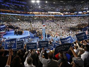 Democratic-Convention-thank-you-signs.jpg Delegates hold up