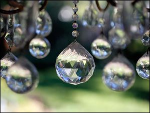 FEA-wiarjanice01p-chandelier.jpg Crystals hang from a chandelier in the backyard.