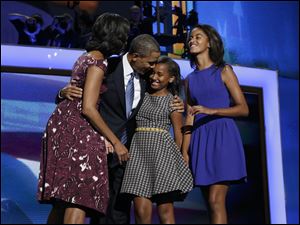Democratic-Convention-Obama-Barack-Michelle-Sasha-Malia.jpg President Barack Obama, left, is joined on stage by first lady Michelle Obama, left, and their children Sasha and Malia, on the final day of the Democratic National Convention.