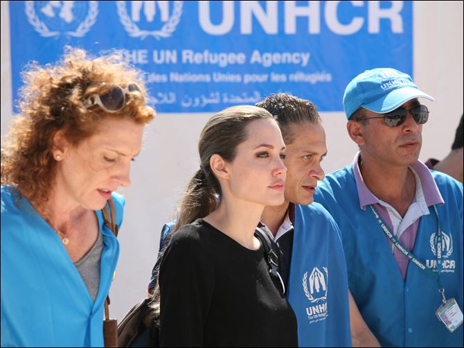 .jpg Mideast Jordan Syria Refuges Angelina Jolie The U.N. refugee agency's special envoy, actress Angelina Jolie, center, arrives to the Zaatari Refugees Camp in Jordan for Syrians who fled the civil war in their country.