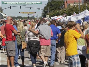 A-festival-brings-out-a-crowd.jpg A festival brings out a crowd in downtown Perrysburg.