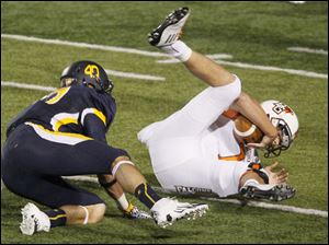 Bowling-Green-quarterback-Matt-Schilz-1.jpg Bowling Green quarterback Matt Schilz is sacked by Toledo linebacker Trent Voss during the second quarter of their football game at the Glass Bowl in Toledo.