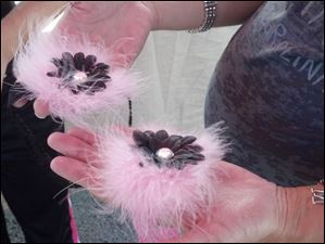 Melissa-Lewicz-of-Perrysburg.jpg Melissa Lewicz, of Perrysburg, tries to decide between the pink band and the black band for a feathery hair bow for a baby she is expecting soon as she shops at the Raining Babies booth at Harrison Rally Day.