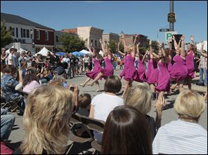 Perrysburg-High-School-s-Women-s-Select-Show-Choir.jpg Perrysburg High School's Women's Select Show Choir performing at the festival. A festival brings out a crowd in downtown Perrysburg.