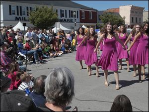 Perrysburg-High-School-s-Women-s-Select-Show.jpg Perrysburg High School's Women's Select Show Choir performing at the festival. A festival brings out a crowd in downtown Perrysburg.