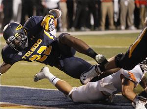 Toledo-running-back-David-Fluellen-scores-a-touchdown.jpg Toledo running back David Fluellen scores a touchdown during the second quarter of the Rockets' football game against Bowling Green at the Glass Bowl in Toledo.