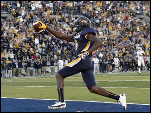 University-of-Toledo-wide-receiver-Alonzo-Russell-9-scores.jpg University of Toledo wide receiver Alonzo Russell (9) scores a touchdown against Bowling Green during the first quarter.