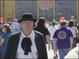Frank-Butwin-of-Perrysburg.jpg Frank Butwin, of Perrysburg, from the Perrysburg Area Historic Museum table. A festival brings out a crowd in downtown Perrysburg.