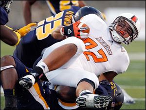 Alex-Bayer.jpg Bowling Green tight end Alex Bayer is stopped by the Toledo defense.