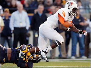 Anthon-Samuel-1.jpg Bowling Green running back Anthon Samuel leaps for extra yards against Toledo.