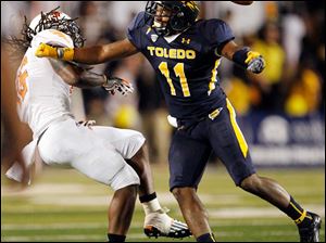 Cheatham-Norrils-1.jpg Toledo cornerback Cheatham Norrils, right, breaks up a pass intended for Bowling Green receiver Je'Ron Stokes.