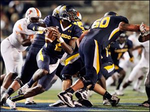 Terrance-Owens-1.jpg Toledo quarterback Terrance Owens looks to throw against Bowling Green.