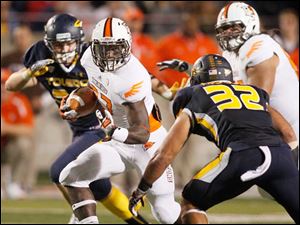 Jamel-Martin.jpg Bowling Green running back Jamel Martin picks up yardage as he is pursued by Toledo linebacker Dan Molls.