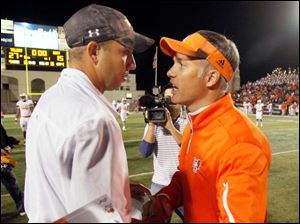 coaches-meet.jpg Toledo coach Matt Campbell, left, and Bowling Green coach Dave Clawson meet after the Rockets beat the Falcons 27-15.
