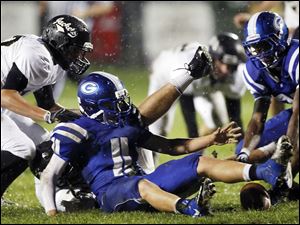 SPT-NLLfootball22p-2.jpg Anthony Wayne running back Josh Schwerer (11) fumbles the ball.