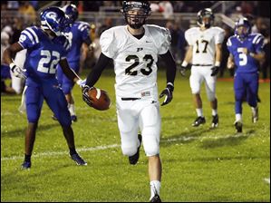 SPT-NLLfootball22p-3.jpg Perrysburg wide receiver Austin Bishop (23) scores a touchdown.