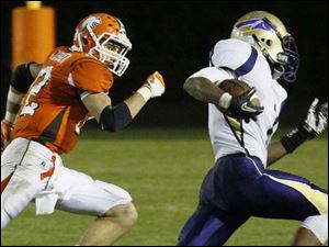 WEBsylv-southviewfball22p-13.jpg Southview's senior Damian Greisiger keeps his eye on Maumee's senior wide receiver Dominique King.