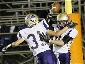 WEBsylv-southviewfball22p.jpg Maumee's senior wide receiver Alex Schrinel, left, celebrates senior wide receiver Sean McGovern's touchdown.