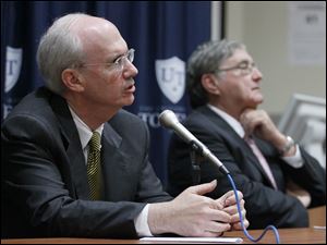 UTMC-town-hall.jpg Dr. Jeff Gold, Chancellor and executive vice-president for biosciences and health affairs and dean of the College of Medicine and Life Sciences, speaks as UT president Dr. Lloyd Jacobs listens at a town hall forum Friday at the University of Toledo Medical Center.