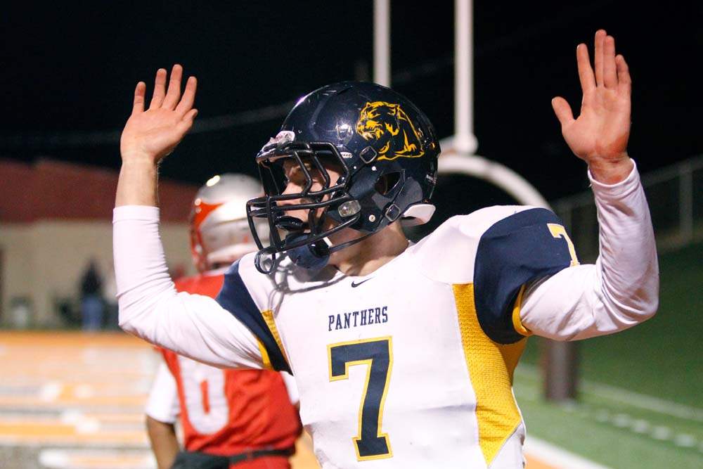 Whitmer-wins-semifinal-arms-up